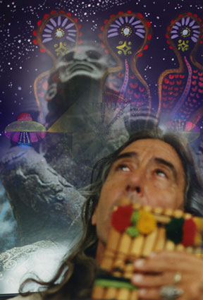 [Photo Montage of José Argüelles/Valum Votan playing the Pan Pipes]
